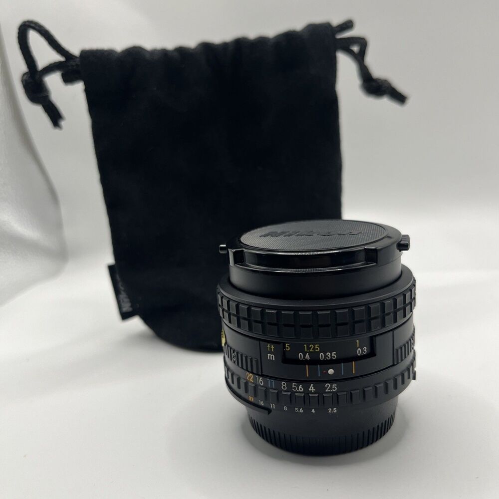 Nikon SERIES E 35mm 1:2.5 Lens w/ Caps, And Bag